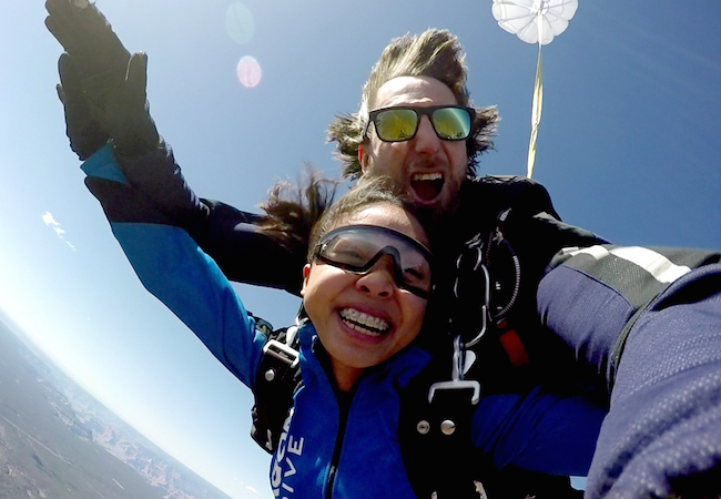 Tandem skydivers mid-jump over Las Vegas