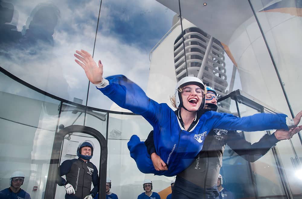 A cruise guest experiencing Royal's Skydiving simulator Skydiving simulator a great activity for first time cruisers
