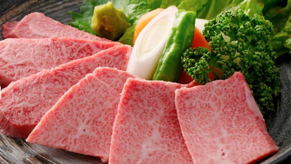 Slices of raw Kobe beef ready to be grilled as yakiniku