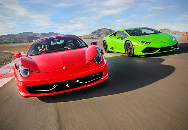 Ferrari Italia and Lamborghini Huracan race around the exotics racing course