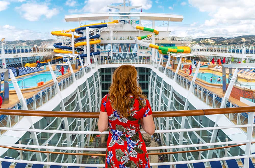 Cruise guest looking over the impressive Symphony of the Seas Symphony of the Sea, the largest cruise ship in the world