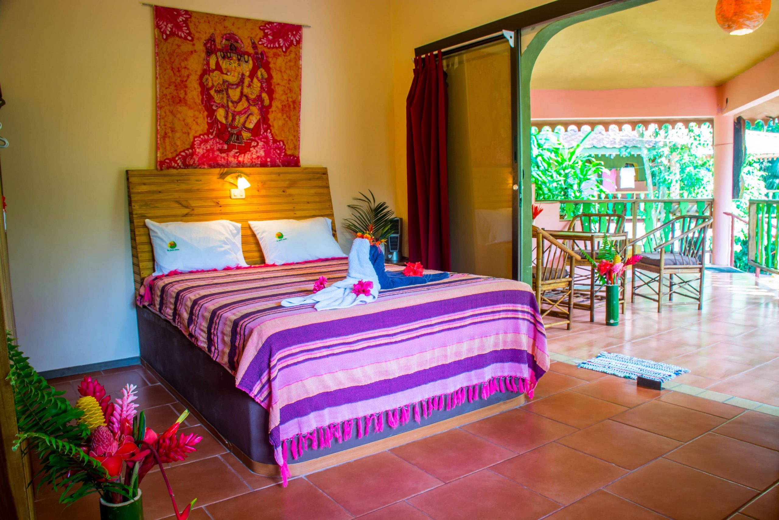 The brightly colored rooms at The Goddess Garden in Costa Rica are very tropical for a yoga retreat experience.