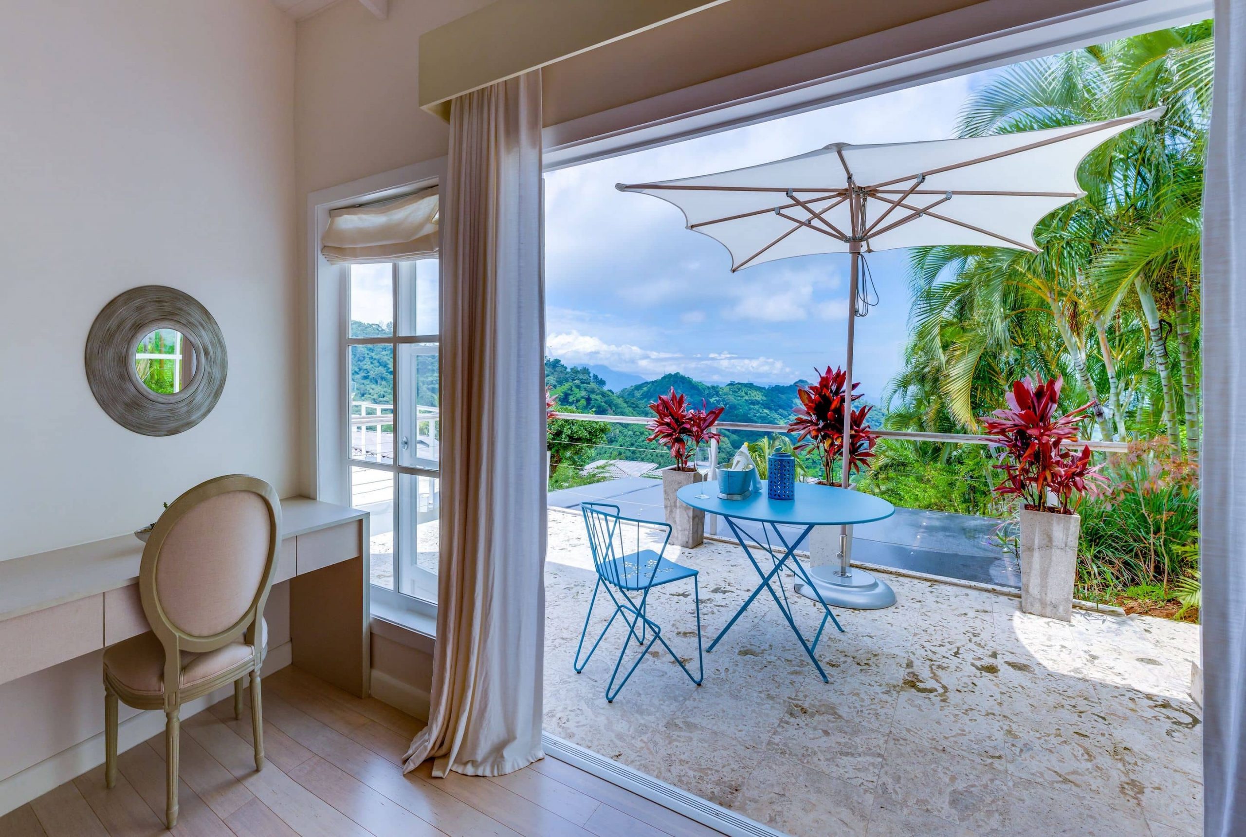 Beautiful decor accompanies guest rooms at The Retreat in Costa Rica, a premium yoga retreat experience with tropical plants and views all around.