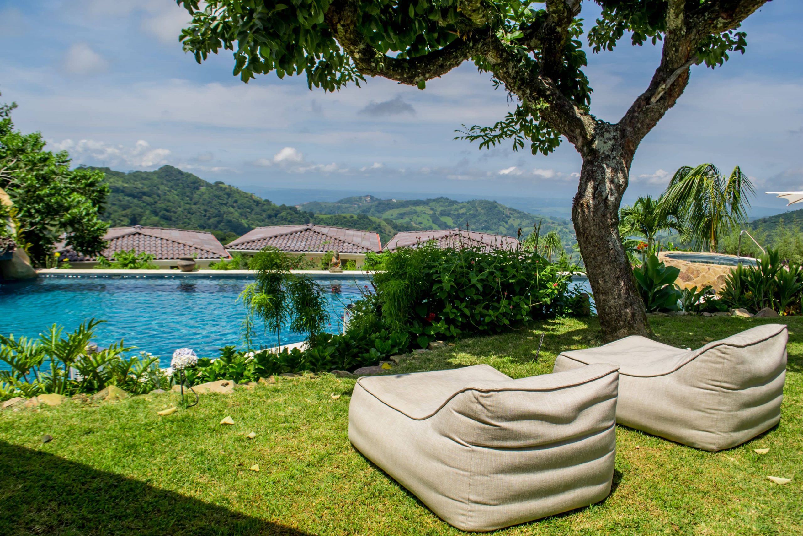 Amazing poolside views and comfort are offered at The Retreat in Costa Rica, including big sun beds by the pool.