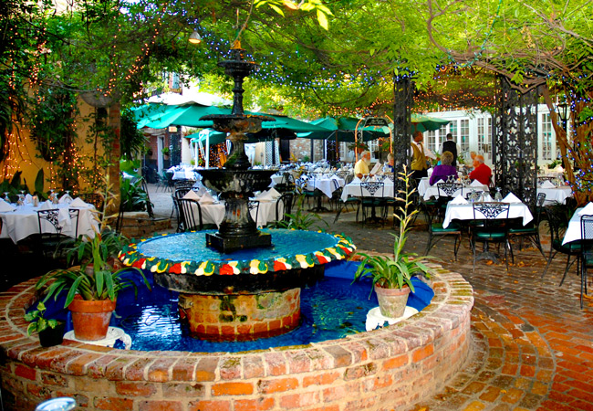 Vine draped courtyard at Court of Two Sisters restaurant