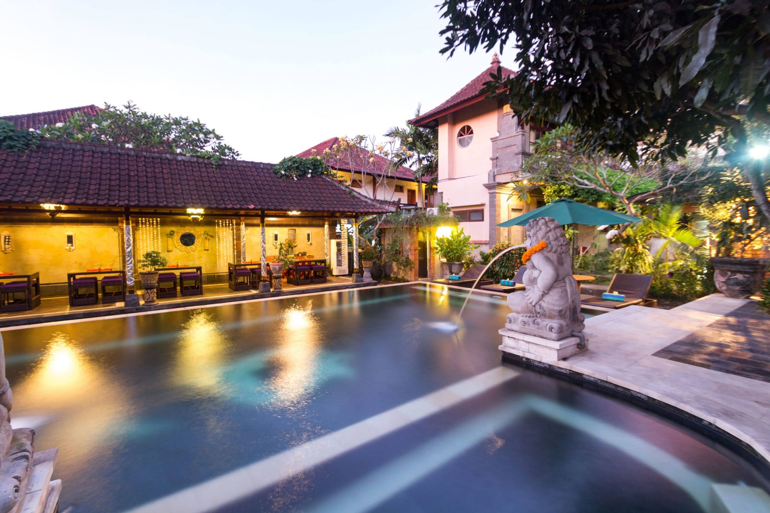 The beautiful outdoor pool area at the Ubud Aura Retreat Center for yoga and tropical peace.