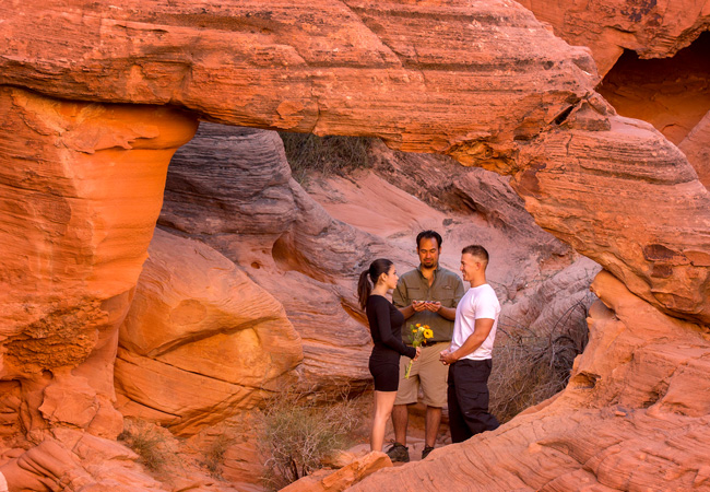 wedding ceremony taking place in rocky desert scene