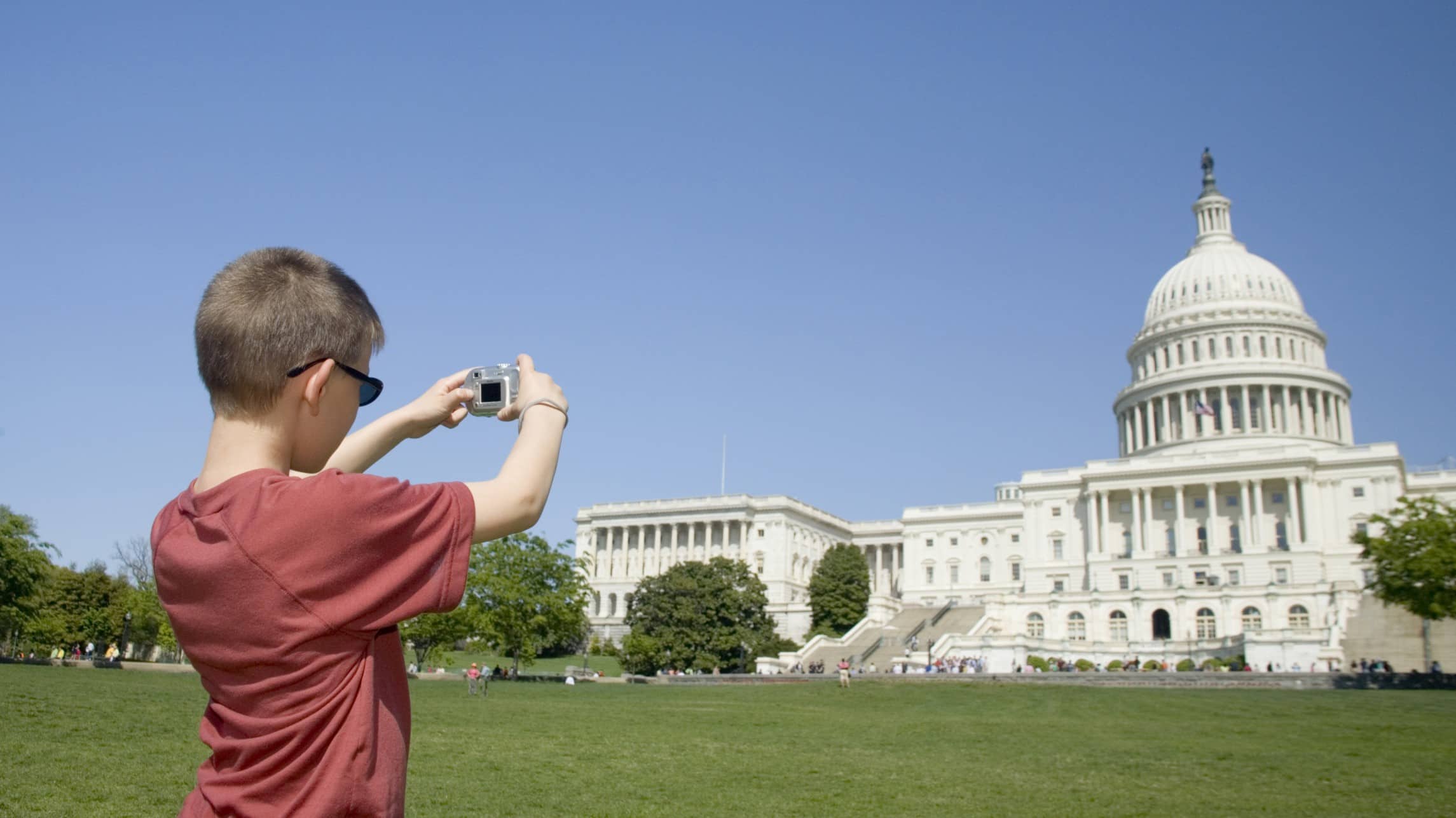 Kid photographing the capital building in Washington DC