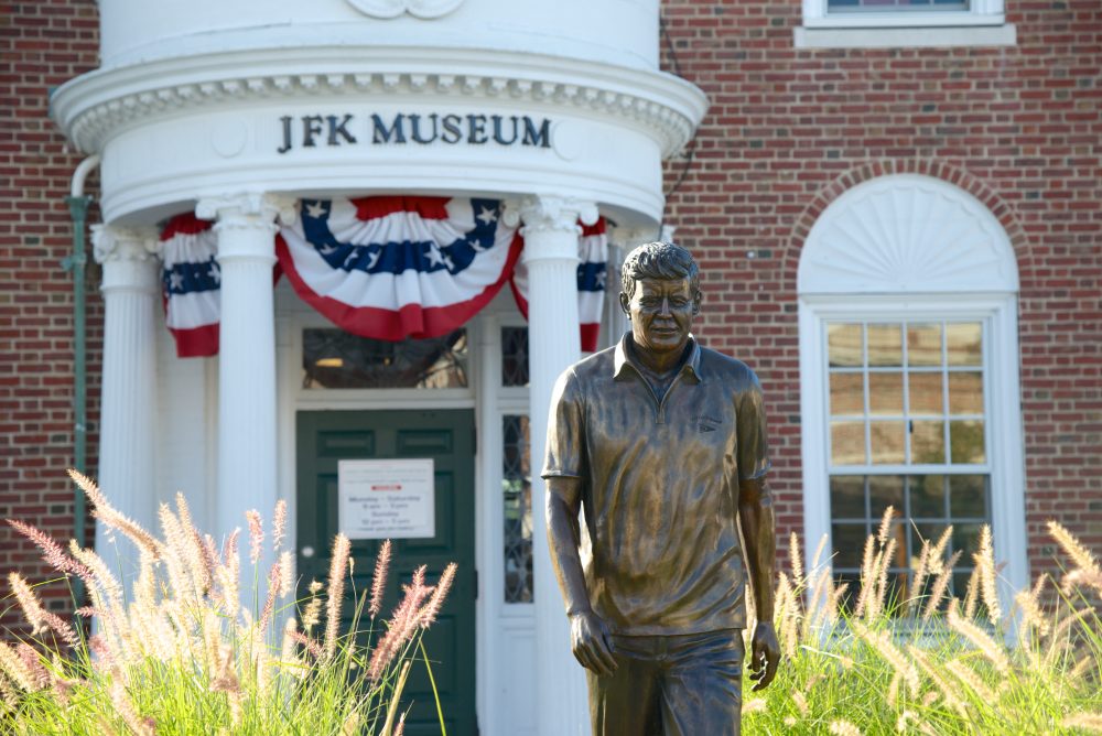 A statue of John F. Kennedy stands in front of the John F. Kennedy Hyannis Museum