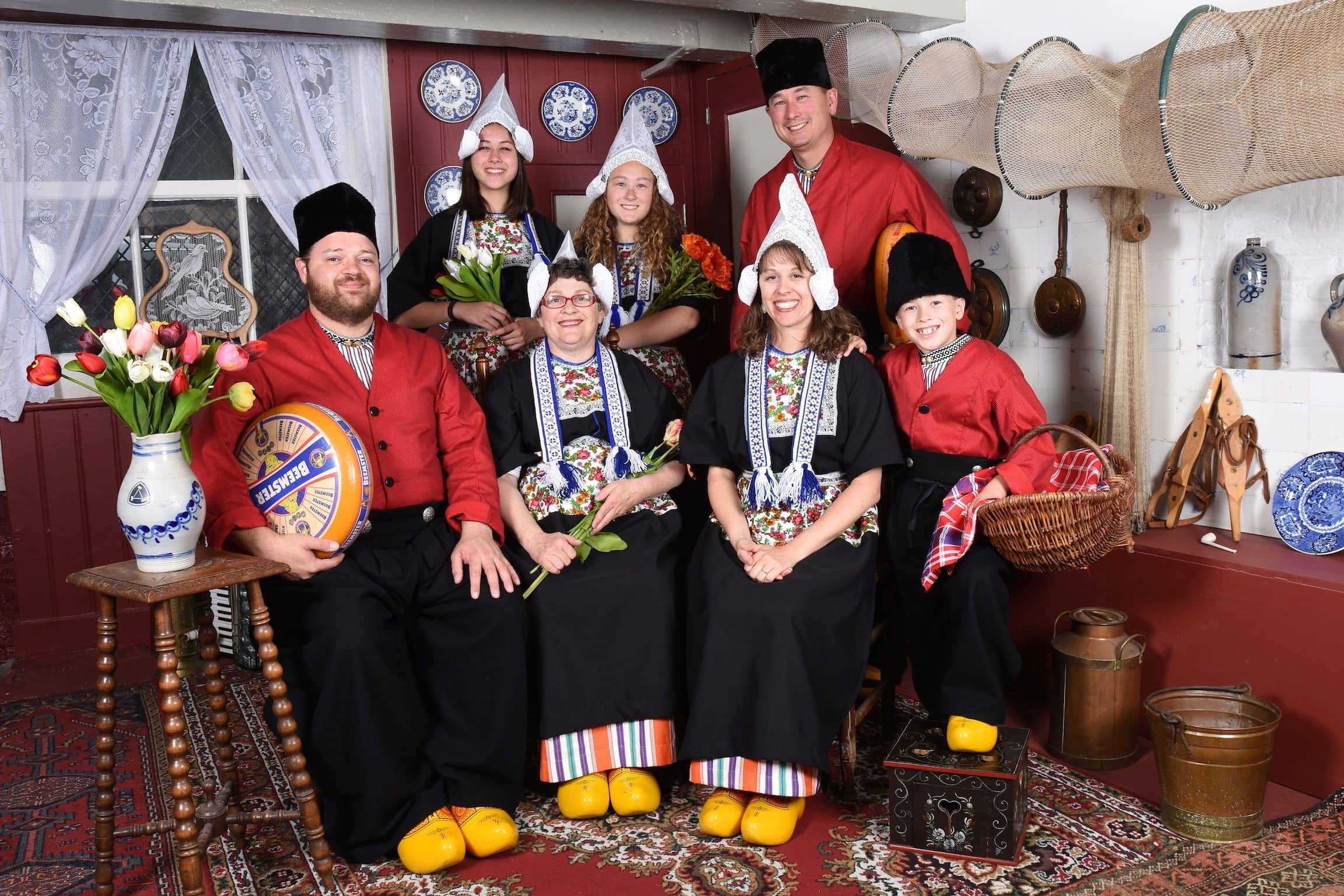 Whole family dressed up in traditional Dutch costume to make a great family vacation photo