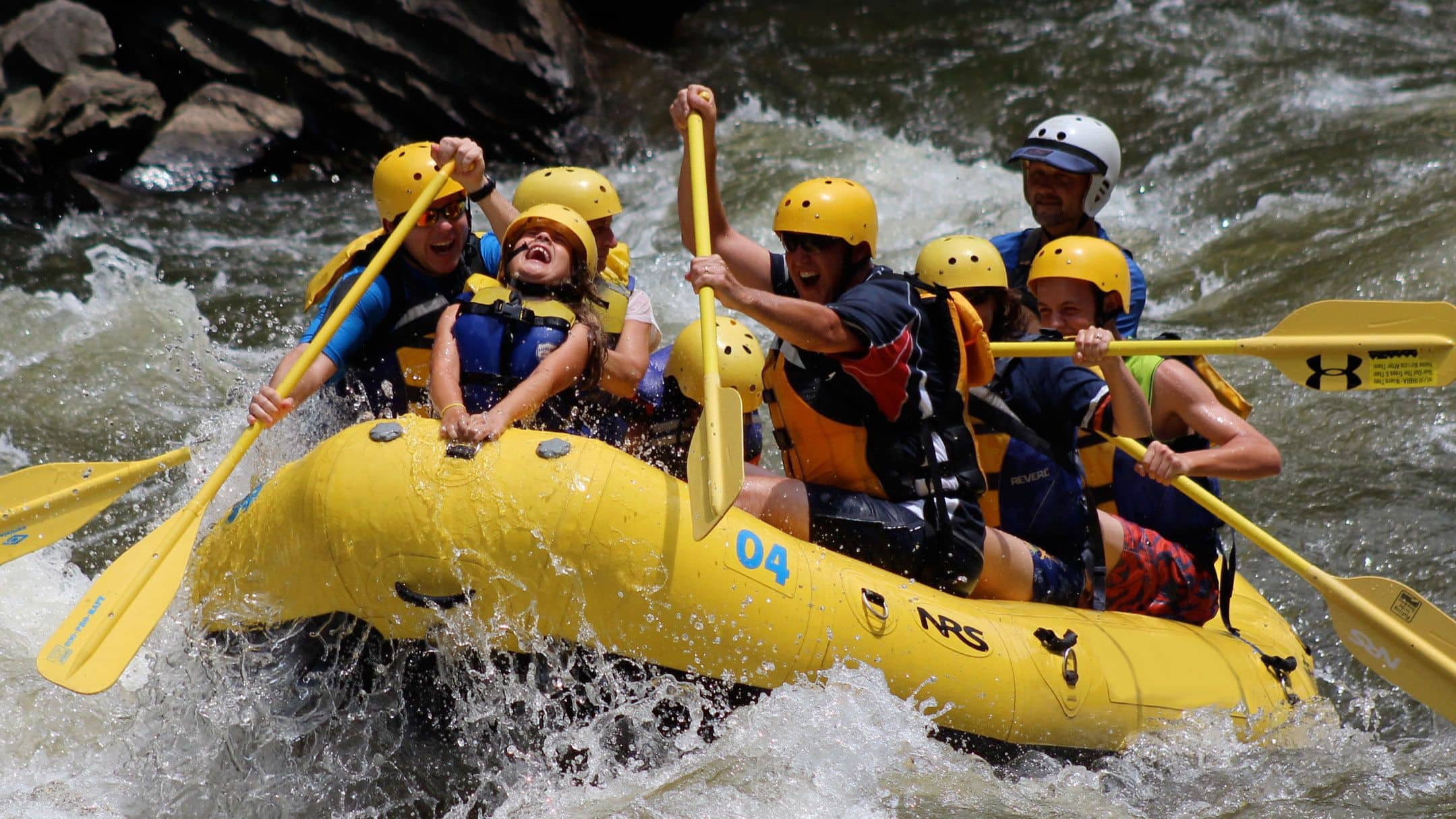 Family travel adventures while whitewater rafting near Pigeon Forge in Tennessee