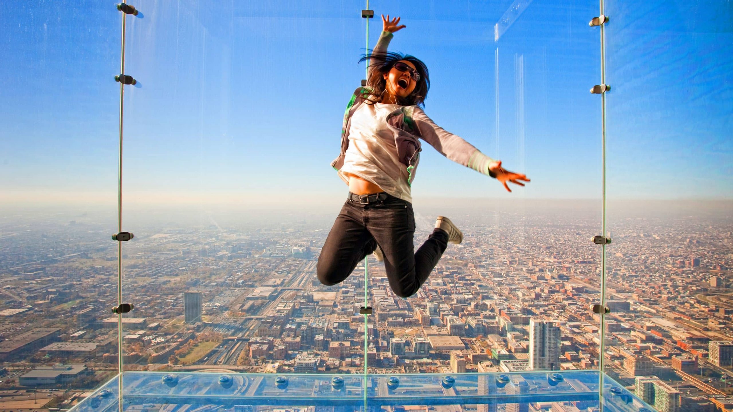 A woman feels joyful at the WIllis Tower.