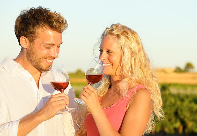 Couple drinking wine at a vineyard in Rome