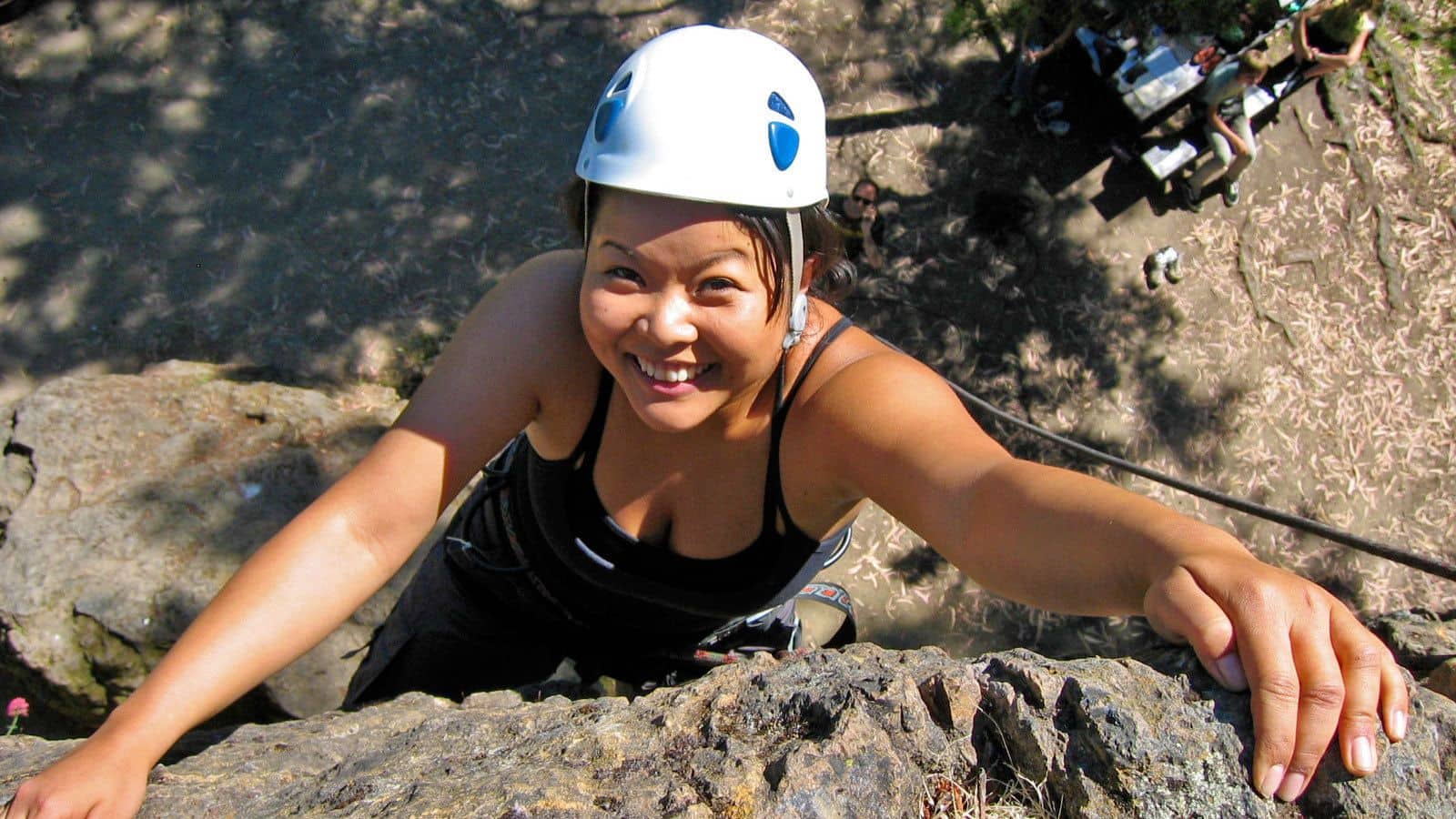 Woman rock climbing in California's Castle Rock State Park