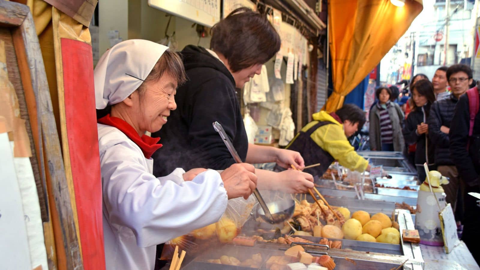 Woman serving food on a walking tour in Tokyo