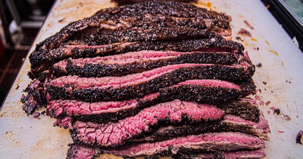  Beautifully sliced BBQ ready for customers to enjoy at Wood Shop BBQ, one of the best cheap eateries in Seattle, Washington.