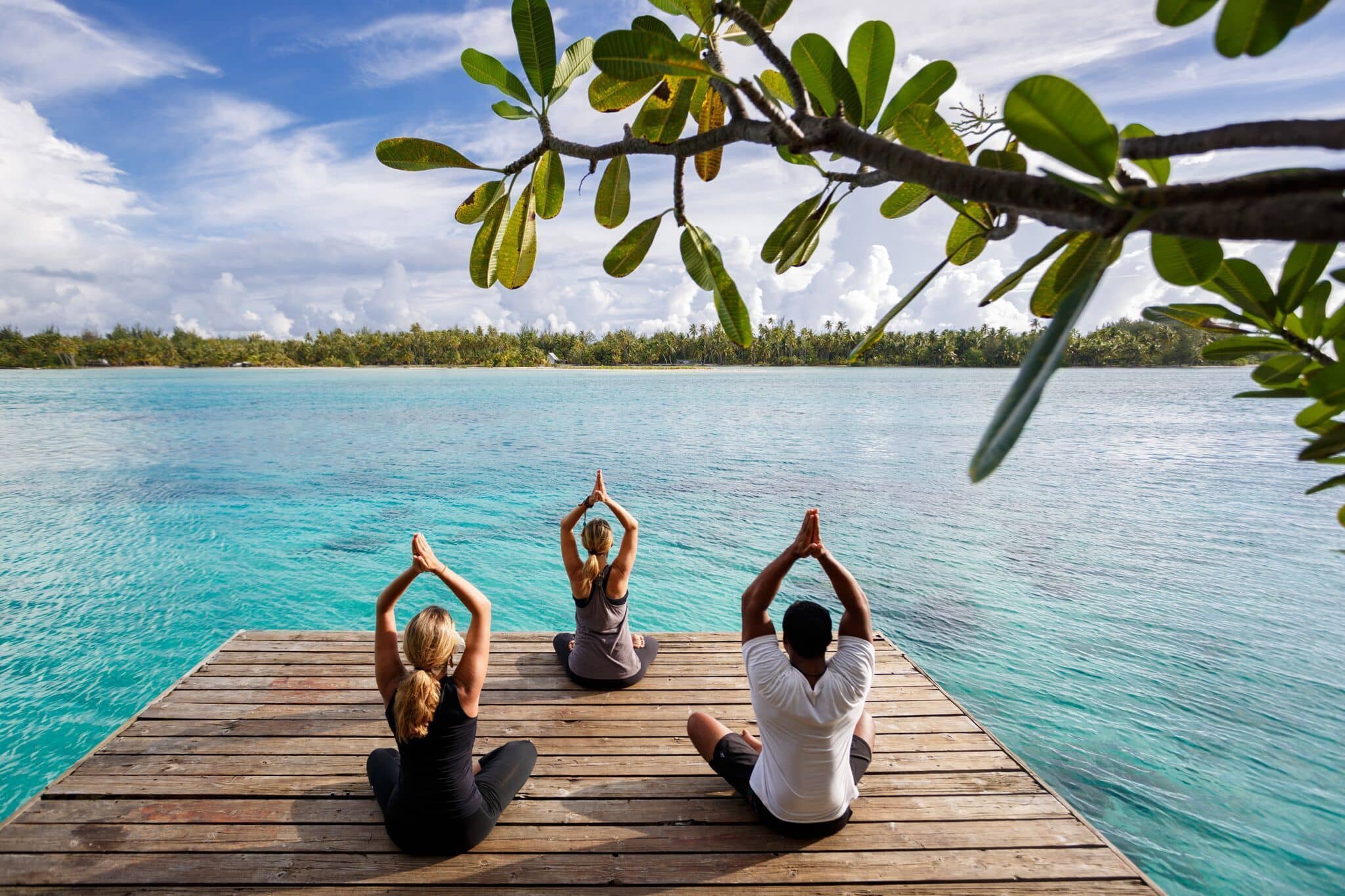 Yoga Outdoors in Bora Bora overlooking a blue lagoon