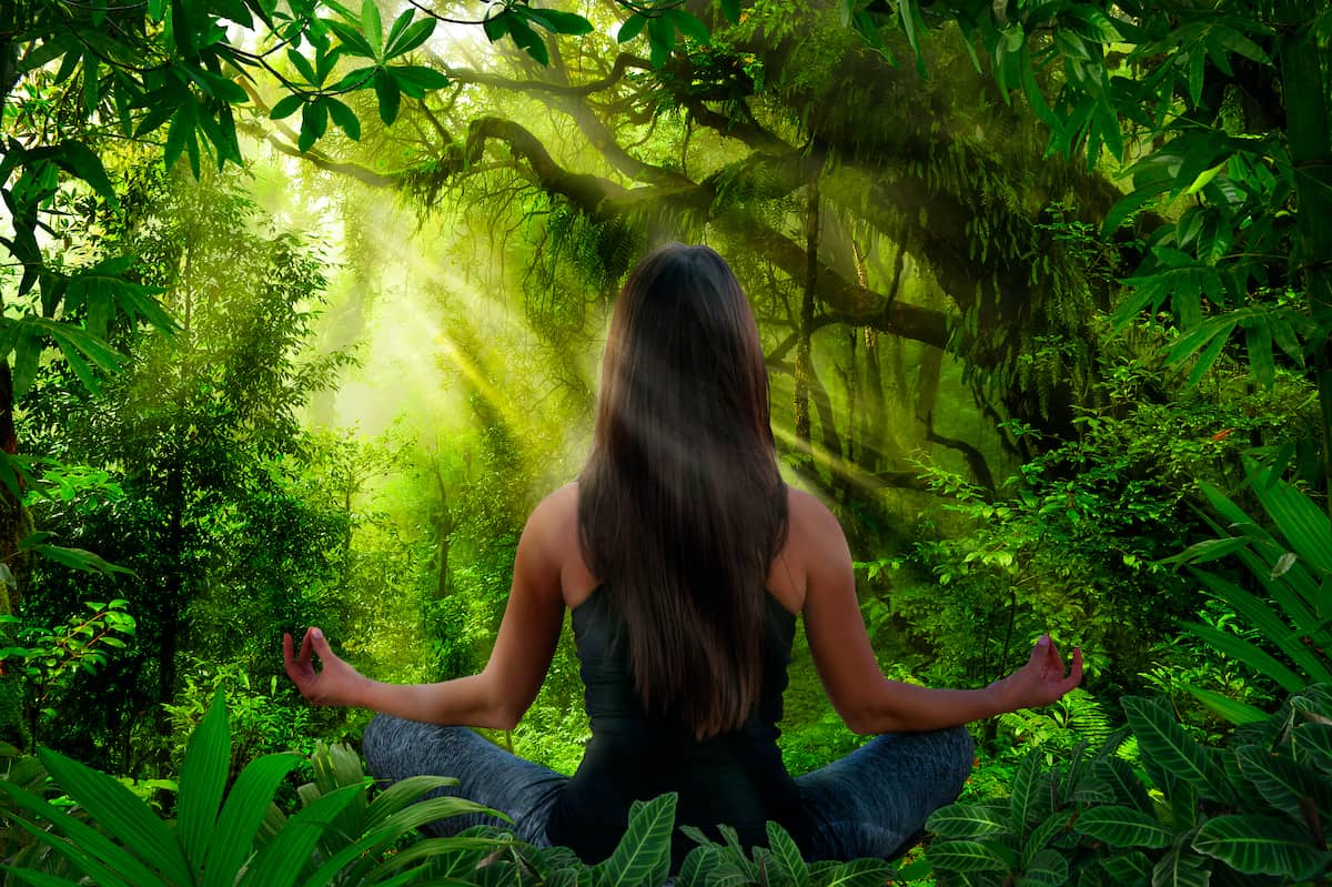 Woman doing yoga and meditation Woman doing yoga and meditation at a yoga retreat in Belize.