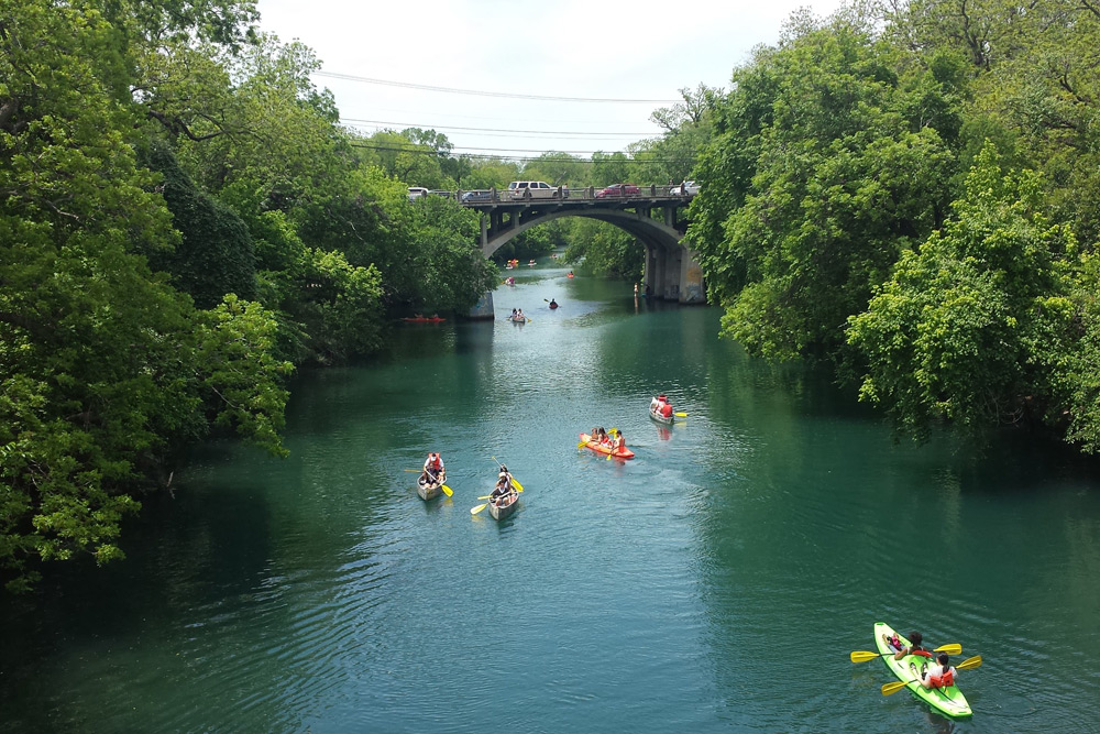 People kayaking in Lady Bird Lake, a top Austin bachelor party idea