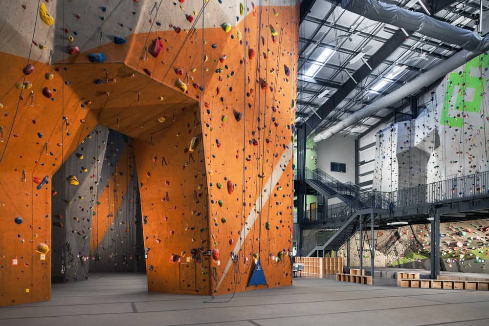 A colorful climbing wall at Climb Nashville, an exciting and challenging Nashville bachelor party idea