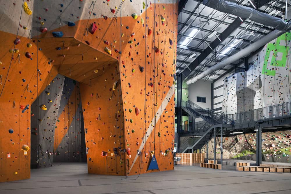 Enjoy indoor climbing at your Nashville bachelor party A colorful climbing wall at Climb Nashville, an exciting and challenging Nashville bachelor party idea
