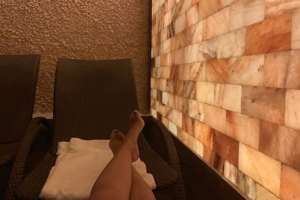 Views of a person’s legs as they relax in the salt cave at the Spa a The LInq, a great activity for bachelorette parties in Las Vegas.