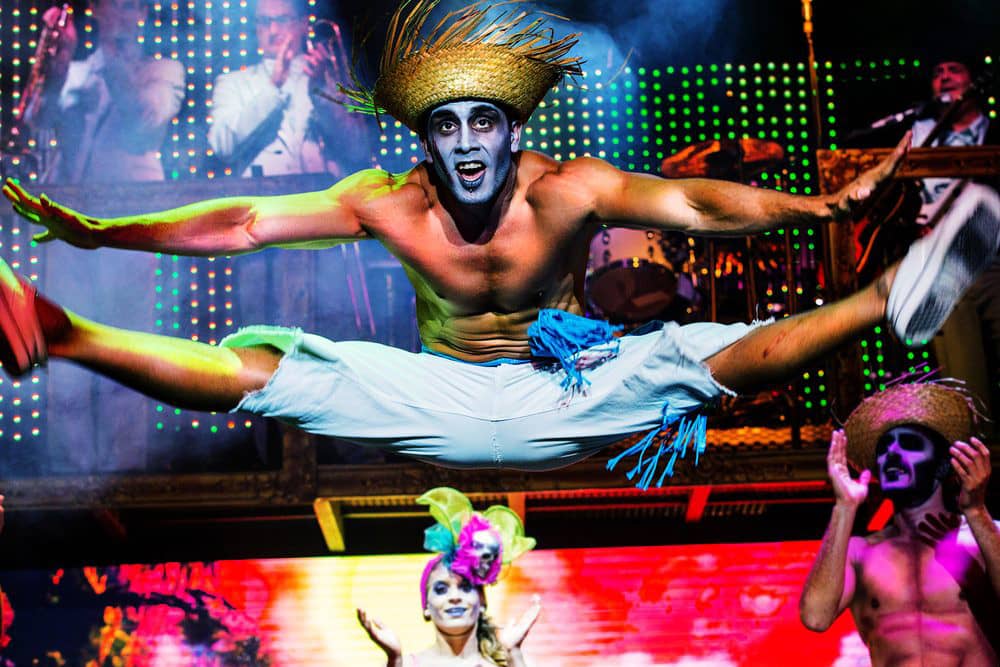 A shirtless man strikes a pose on stage at the Zombie Burlesque show, a prime thing to do for bachelorette parties in Las Vegas. 