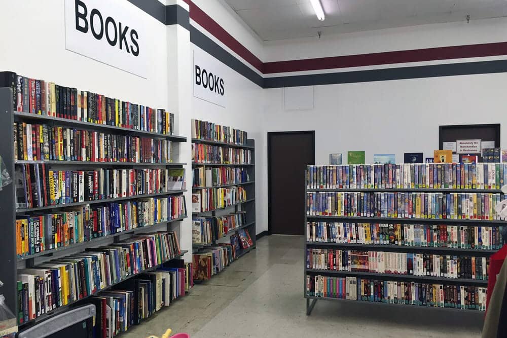 Rows of bookshelves at Anaheim Thrift Store, one of the best thrift stores in Anaheim.