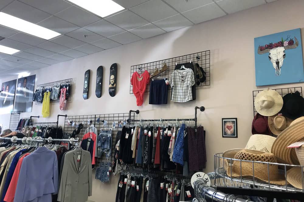 Racks of clothes at Working Wardrobes, one of the best thrift stores in Anaheim.