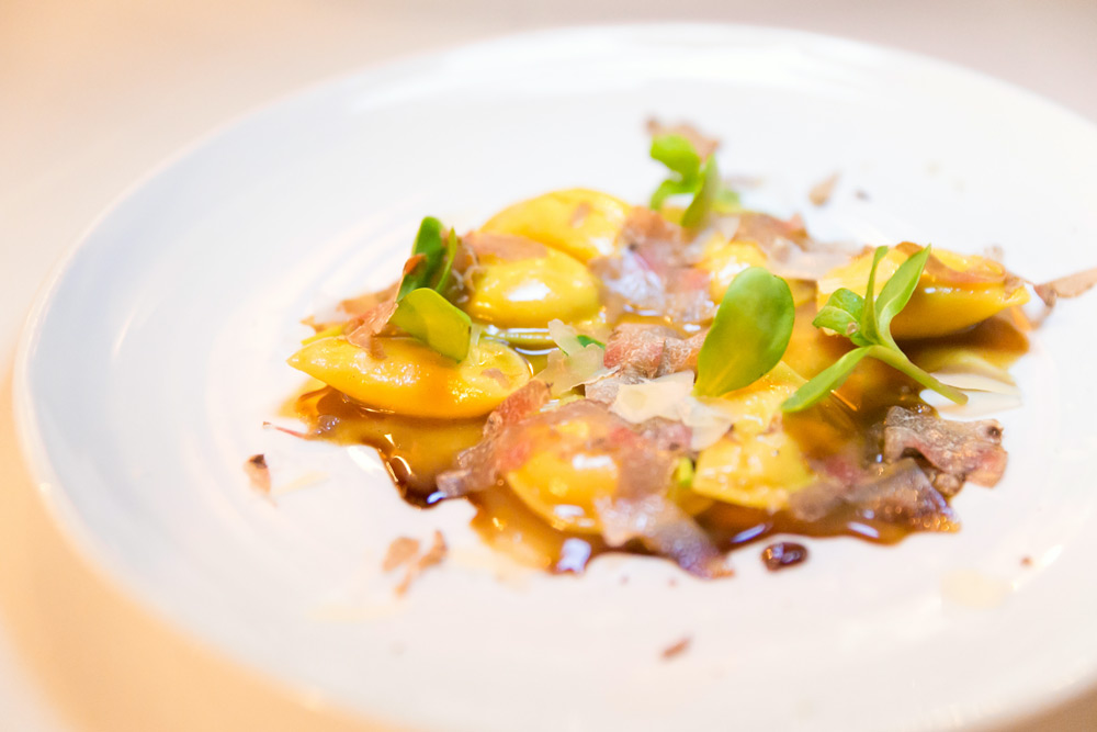  Bright mezze plate of truffles and golden beets at FIG—a date idea in Charleston with no reservations required.