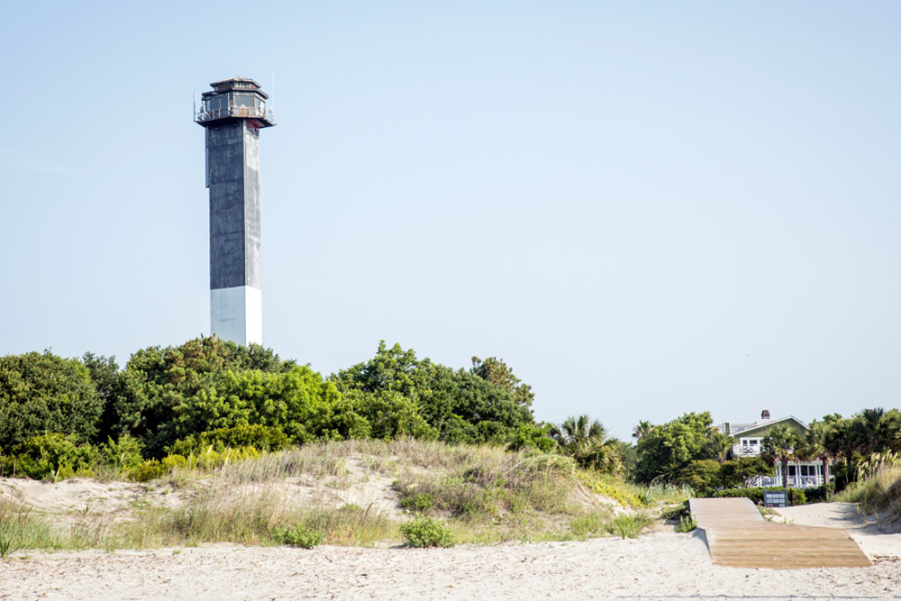 Celebrate a relationship milestone on Sullivan's Island A lighthouse and boardwalk to the sand on Sullivan's Island in Charleston. It's a great date idea for special occasions.