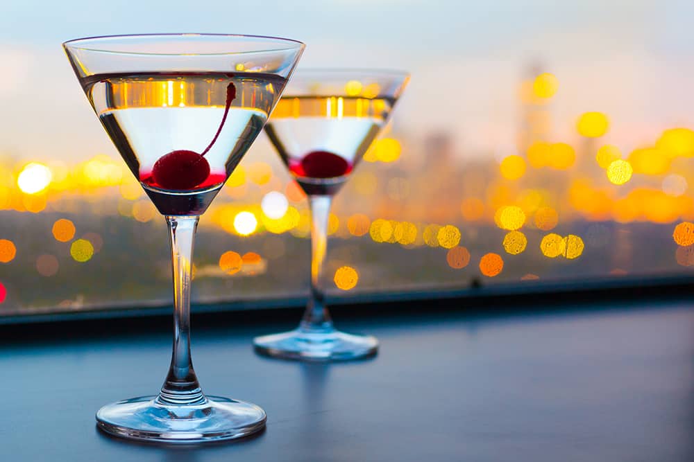 Late Night Cocktails; Date Ideas in Chicago Two cocktails with cherry garnish - Chicago date ideas