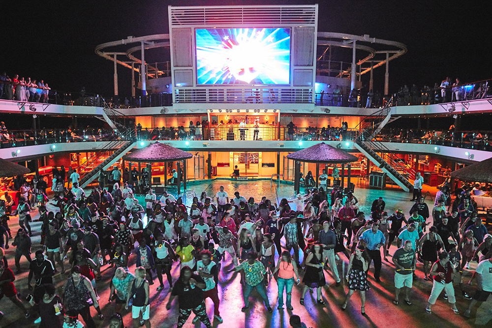 Guests dancing at a deck party