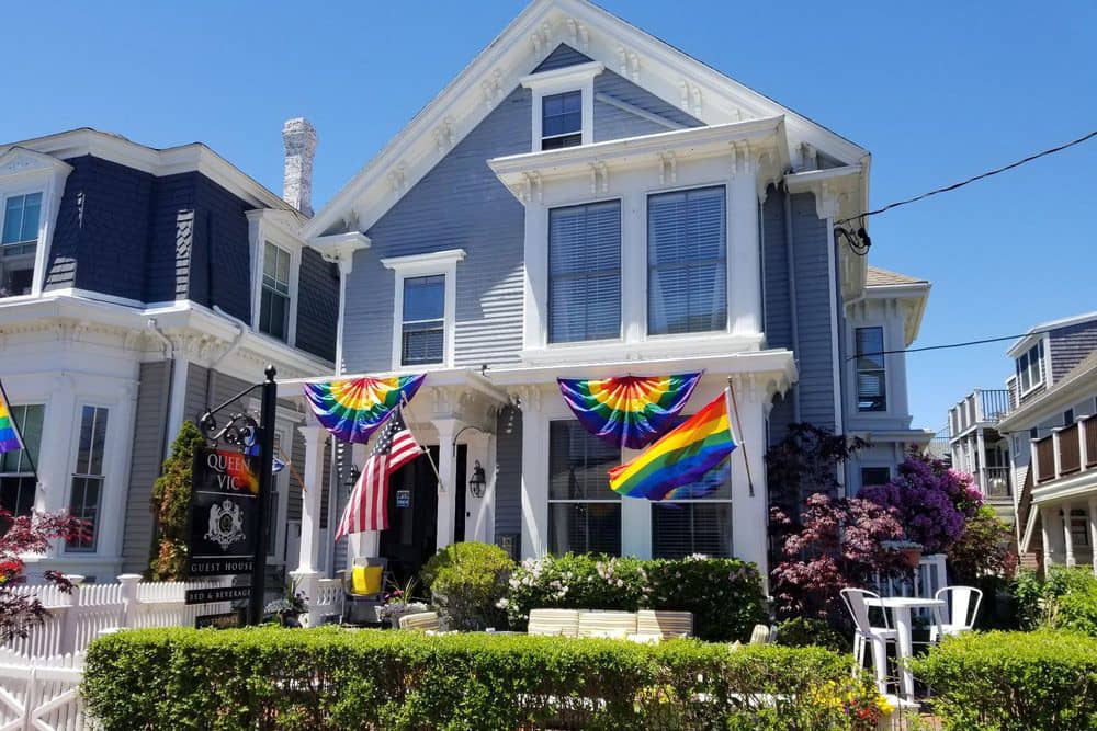 Rainbow Pride banners decorate the historical Queen Vic Guest House for Carnival in Provincetown.