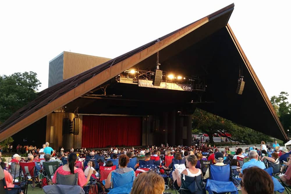 Crowd sits in front of stage at Miller Outdoor Theatre, one of the best free things to do with kids in Houston.