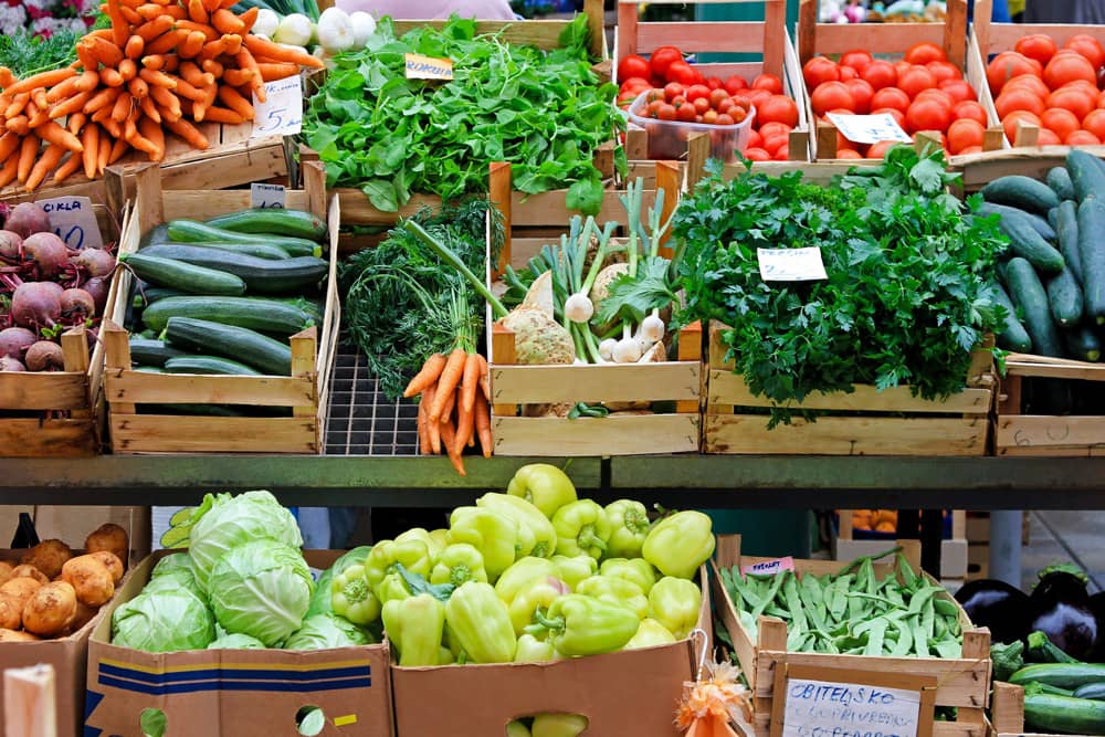 A colorful selection of fresh vegetable crates at the farmers market in San Diego, a free activity to do with kids.