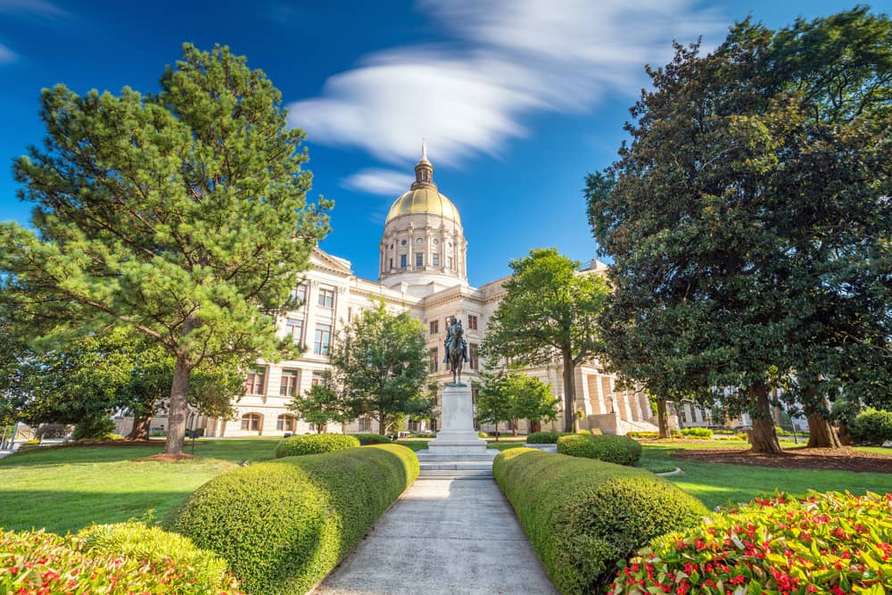 Tour the Capitol Museum with a golden dome, hedge-lined path, and green lawn for one of Atlanta's best free things to do with kids.