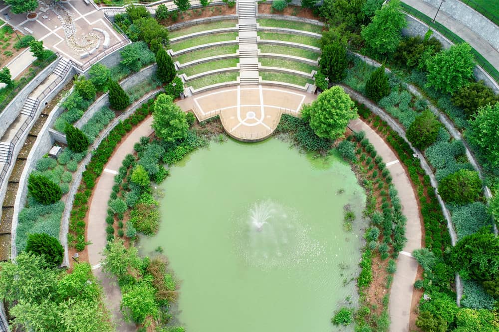 Families looking for free things to do in Atlanta love the circular green garden around the Fountain of Rings Historic Fourth Ward Park.