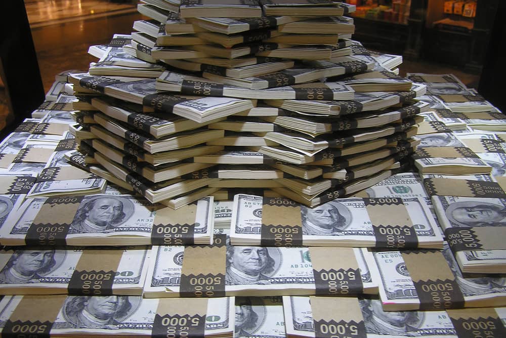 Stacks of 100-dollar bills arranged at Atlanta Monetary Museum. Kids love seeing millions of dollars