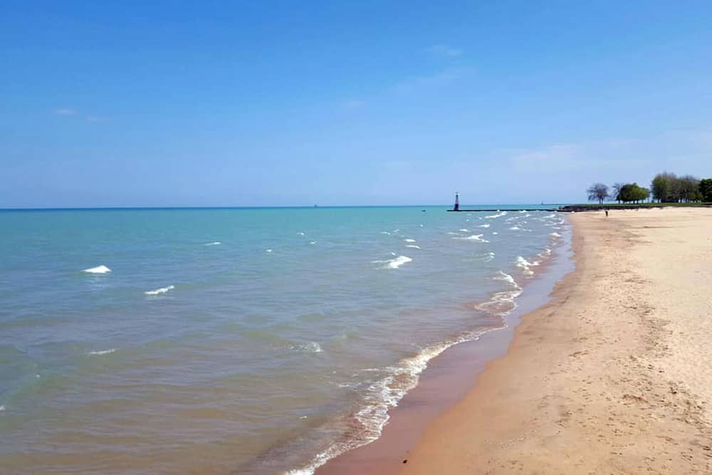 The view of the water and sand at Foster Avenue Beach, a great free thing to do with kids in Chicago.