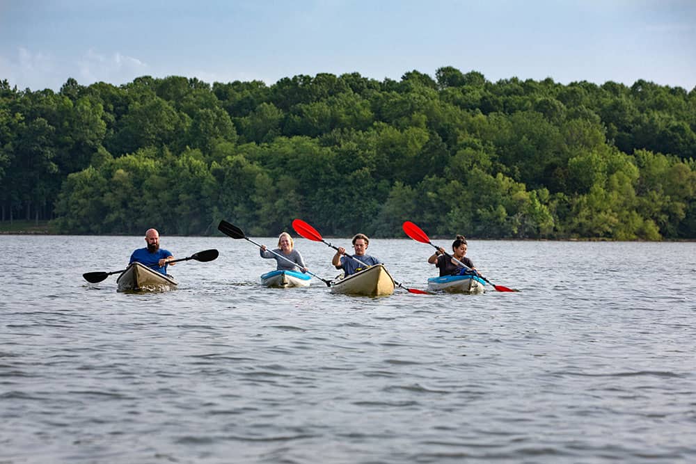 people kayaking on freeman lake in elizabethtown, kentucky