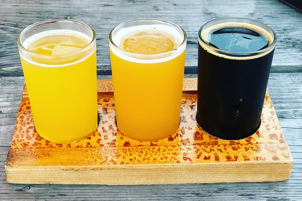 Portland Breweries things to do; Guide to Portland Dining Month Portland beer taster flight - Portland Dining Month