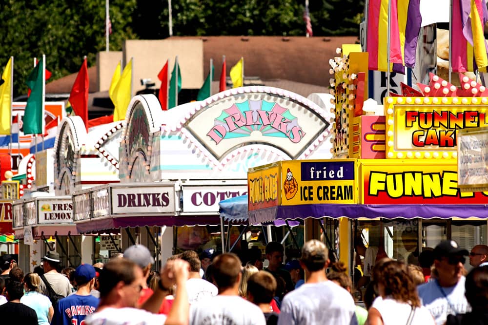 Brightly colored food stands at the Iowa State Fair