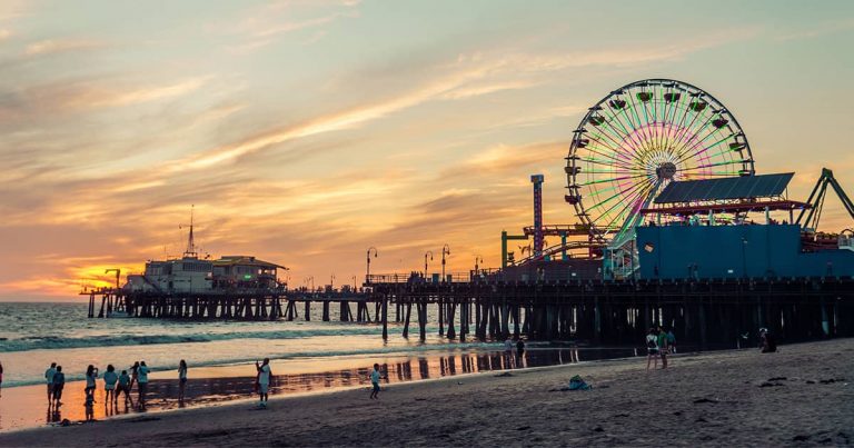 The Santa Monica Pier at sunset, which makes for a great LA date spot.