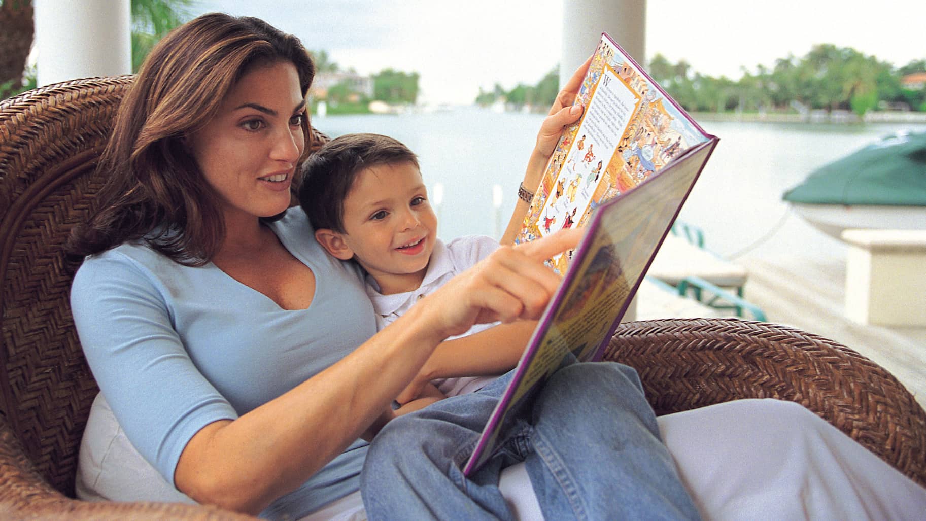 Mother and son reading about foreign countries and cultures