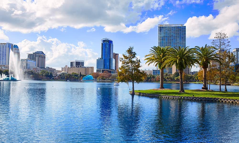 The skyline of Orlando in the background of Lake Eola