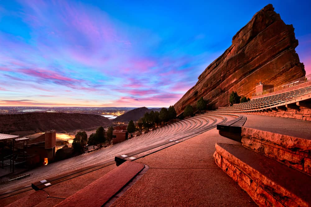 scenic red rocks amphitheater and sweeping view of denver colorado at sunset