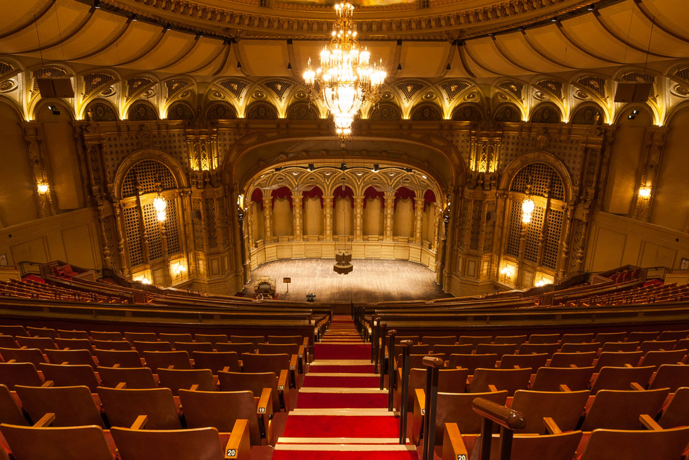 View from the velvet seats looking at the ornate golden stage at Orpheum Theatre—a special occasion date spot.