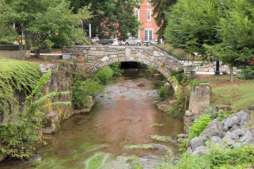 stone foot bridge in staunton virgina in summer