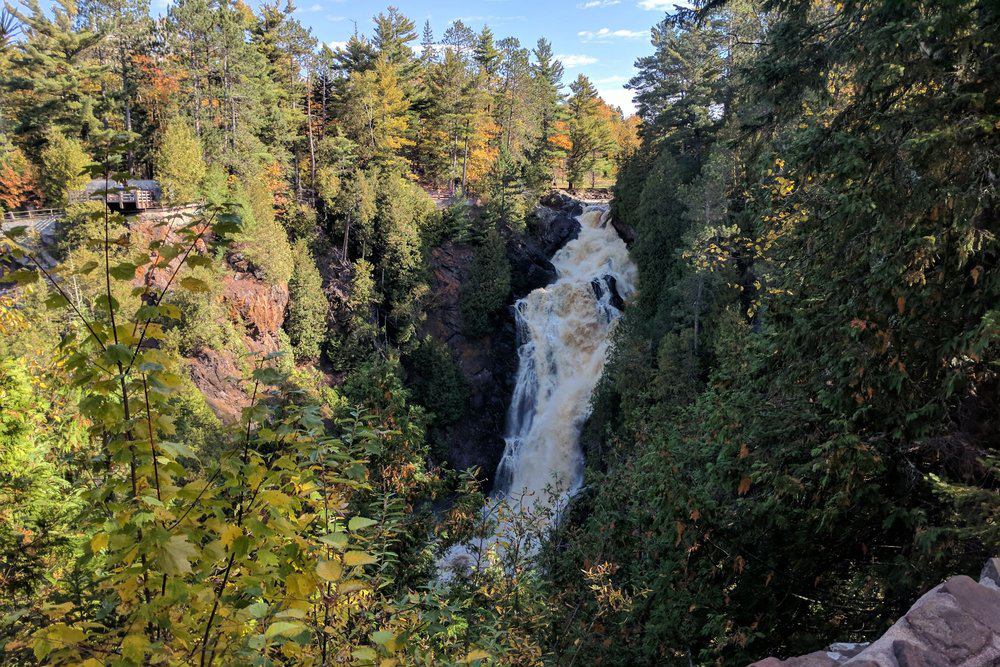 rushing waterfall in a park in superior, wisconsin